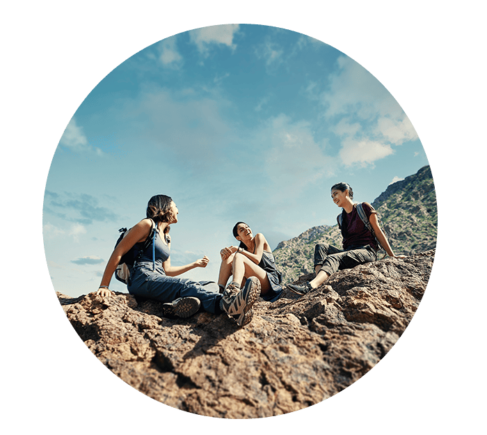 Women on top of El Paso Aztec Trail Rocks