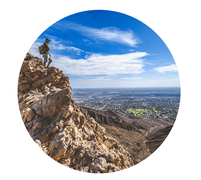 Mountain climber on the franklin mountains overlooking el paso