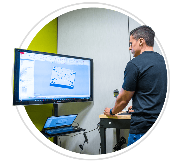 Man sitting at computer with 3D model