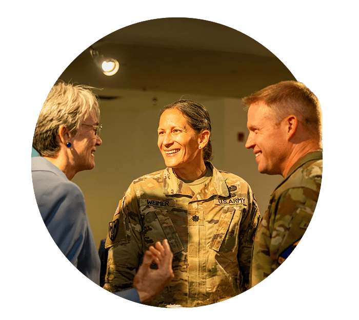 Military soldiers talking to a civilian